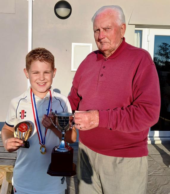 Evan Martin presents a trophy at Hook CC